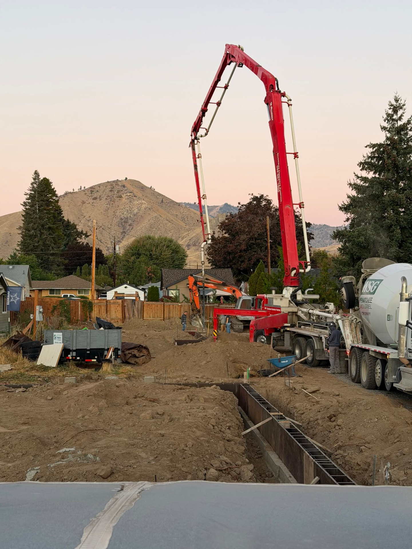 Concrete being poured for a Habitat home foundation on Wilson Street